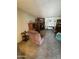 A spacious living room with fireplace and a comfortable armchair at 2102 W Hazelwood St, Phoenix, AZ 85015