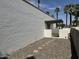 Enclosed backyard featuring a stone pathway and gravel ground cover, offering a private outdoor space at 220 S Old Litchfield Rd # 104, Litchfield Park, AZ 85340