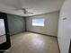 Bright and airy bedroom with tile floors and a ceiling fan, creating a peaceful atmosphere at 220 S Old Litchfield Rd # 104, Litchfield Park, AZ 85340