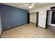 Well-lit bedroom with tile floors, a ceiling fan, and a closet, providing a serene retreat at 220 S Old Litchfield Rd # 104, Litchfield Park, AZ 85340