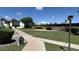 Beautifully maintained community with lush landscaping and walkways at 220 S Old Litchfield Rd # 104, Litchfield Park, AZ 85340
