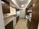 Functional kitchen featuring white appliances and ample cabinet space for easy meal preparation at 220 S Old Litchfield Rd # 104, Litchfield Park, AZ 85340