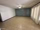 Spacious living room with neutral tile flooring and a ceiling fan, perfect for comfortable living at 220 S Old Litchfield Rd # 104, Litchfield Park, AZ 85340