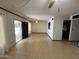 Bright living room with tile floors and access to the patio, blending indoor-outdoor living at 220 S Old Litchfield Rd # 104, Litchfield Park, AZ 85340