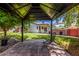 Secluded backyard gazebo offers a private retreat for relaxation overlooking lush landscaping and open green space at 2230 N Los Alamos --, Mesa, AZ 85213