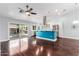Open-concept kitchen flowing into living area with a pool view, featuring modern appliances and spacious design at 2230 N Los Alamos --, Mesa, AZ 85213