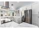 Bright kitchen featuring stainless steel appliances, white cabinets, and elegant marble countertops at 2230 N Los Alamos --, Mesa, AZ 85213