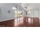 Bright and airy living room featuring hardwood floors, vaulted ceilings, and sliding glass door to the patio at 2230 N Los Alamos --, Mesa, AZ 85213