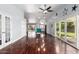Spacious living area showcasing hardwood floors, modern lighting, and seamless transition to outdoor space at 2230 N Los Alamos --, Mesa, AZ 85213