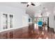 Inviting living room with hardwood floors, recessed lighting, and open flow to the kitchen area at 2230 N Los Alamos --, Mesa, AZ 85213