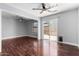 Spacious open-concept living room featuring hardwood floors, ceiling fans, and natural light at 2230 N Los Alamos --, Mesa, AZ 85213