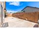 Spacious backyard patio with block fence and bright blue sky at 2230 N Los Alamos --, Mesa, AZ 85213