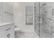 This bathroom features a sleek glass shower, tiled walls, and modern fixtures at 2230 N Los Alamos --, Mesa, AZ 85213