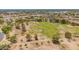 Spacious grassy field surrounded by mature trees and walking paths, ideal for outdoor activities at 2234 E Lawrence Rd, Phoenix, AZ 85016