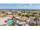 Backyard aerial view featuring a well maintained yard, patio area, and sparkling blue pool at 2234 E Lawrence Rd, Phoenix, AZ 85016