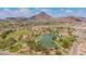 Expansive neighborhood park with a large lake, grassy areas, and lush trees against a mountain backdrop at 2234 E Lawrence Rd, Phoenix, AZ 85016