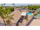 A lush backyard view featuring a sparkling pool and covered patio perfect for outdoor relaxation and entertaining at 2234 E Lawrence Rd, Phoenix, AZ 85016