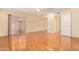 Large bedroom with hardwood floors, mirrored closet doors, and sliding glass door at 2234 E Lawrence Rd, Phoenix, AZ 85016