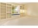 Bedroom featuring built-in shelving, a window seat and neutral carpet at 2234 E Lawrence Rd, Phoenix, AZ 85016