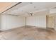 Spacious garage featuring ample storage with built-in cabinets and shelving along the walls at 2234 E Lawrence Rd, Phoenix, AZ 85016