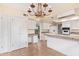 Well-appointed kitchen with desk area, tile floors and countertops, and white cabinetry at 2234 E Lawrence Rd, Phoenix, AZ 85016