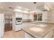 Classic white kitchen featuring tile countertops, white cabinetry, and stainless appliances at 2234 E Lawrence Rd, Phoenix, AZ 85016