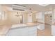 Well-appointed kitchen with tile countertops, white cabinetry, and modern appliances at 2234 E Lawrence Rd, Phoenix, AZ 85016