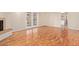 Bright living room features hardwood floors, fireplace, and glass doors to the outdoors at 2234 E Lawrence Rd, Phoenix, AZ 85016