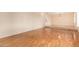 Bright, neutral living room with beautiful hardwood floors and access to the main corridor at 2234 E Lawrence Rd, Phoenix, AZ 85016