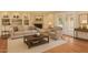 Bright living room showcases hardwood flooring, a cozy fireplace, and stylish furnishings perfect for relaxation at 2234 E Lawrence Rd, Phoenix, AZ 85016