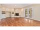 Sunlit living room with hardwood floors, built-in shelving, and French doors to the patio at 2234 E Lawrence Rd, Phoenix, AZ 85016