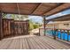 View of the backyard, featuring a shaded wood pergola with views of the pool, and the yard at 2234 E Lawrence Rd, Phoenix, AZ 85016