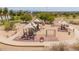 Vibrant playground with shaded structures, swings, and play equipment provides a fun and safe environment for children at 2234 E Lawrence Rd, Phoenix, AZ 85016