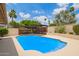 Beautiful backyard with a sparkling blue pool and shaded pergola area for outdoor entertaining at 2234 E Lawrence Rd, Phoenix, AZ 85016
