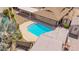 Beautiful sparkling pool with tanning ledge, set within a well-maintained backyard and shed at 2234 E Lawrence Rd, Phoenix, AZ 85016