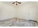 Bedroom featuring tile flooring, a ceiling fan, and a door to the outside at 22737 N Sunset Dr, Maricopa, AZ 85139