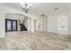 Elegant foyer featuring tile flooring, a staircase with dark wood, and arched doorways, creating a welcoming entrance at 22737 N Sunset Dr, Maricopa, AZ 85139