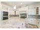 Bright, open kitchen with island, granite counters, and stainless steel appliances at 22737 N Sunset Dr, Maricopa, AZ 85139