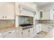 Modern kitchen with stainless steel appliances, granite countertops, and white cabinetry at 22737 N Sunset Dr, Maricopa, AZ 85139