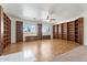 Open living room features extensive built-in bookshelves with warm wood tones at 22737 N Sunset Dr, Maricopa, AZ 85139