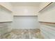 Spacious walk-in closet with custom shelving and plenty of storage at 22737 N Sunset Dr, Maricopa, AZ 85139