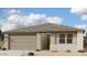 Charming single-story home with a neutral color palette, a two-car garage, and simple landscaping at 2336 E Homesteader Rd, San Tan Valley, AZ 85140