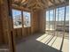 Bright view inside the unfinished room with a framed window showcasing the nearby community at 2336 E Homesteader Rd, San Tan Valley, AZ 85140