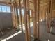 An unfinished interior with exposed framing and utilities, revealing the room layout and construction stage at 2336 E Homesteader Rd, San Tan Valley, AZ 85140