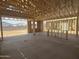 Framing showcases the open-concept layout and ample space of this home, ready for customization at 2336 E Homesteader Rd, San Tan Valley, AZ 85140