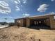 Home under construction showing framing, open garage, and a neighborhood street visible in the background at 2336 E Homesteader Rd, San Tan Valley, AZ 85140