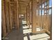 Unfinished interior features stud beams and concrete floor at 2336 E Homesteader Rd, San Tan Valley, AZ 85140
