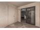 Private patio with sliding door to the interior, a door to a storage room, and an exterior light fixture at 234 N 75Th St # 209, Mesa, AZ 85207