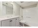 This bright bathroom features a shower-tub combo and a marble-look vanity at 234 N 75Th St # 209, Mesa, AZ 85207