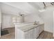 Bright kitchen features granite countertops and a breakfast bar open to the living area at 234 N 75Th St # 209, Mesa, AZ 85207